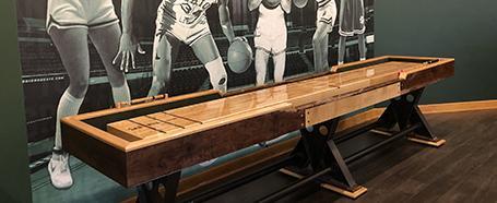 Shuffleboard table inside Hardwood House