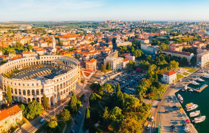Aerial view of the Pula Arena and coast.
