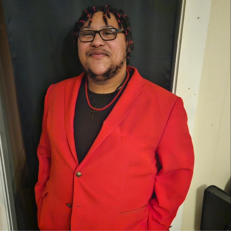 Man in red suit jacket
