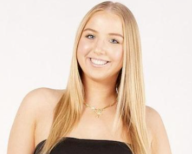 picture of Ambria, young white woman with blonde hair and a black top