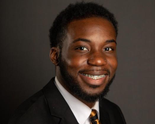 picture of Darnell, young black male with a suit jacket and tie