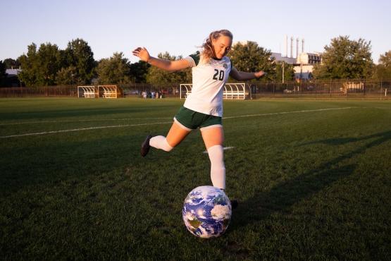 Regan kicking soccer ball 