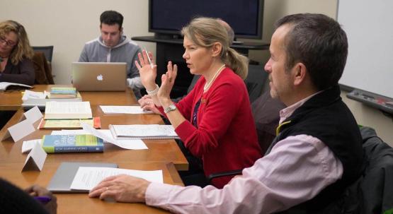 BTA leaders Linda Rice and Raymond Frost engage faculty in a discussion about learning during a BTA meeting.