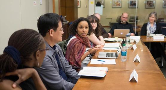 Tenured faculty having discussions with non-tenured faculty at a BTA meeting