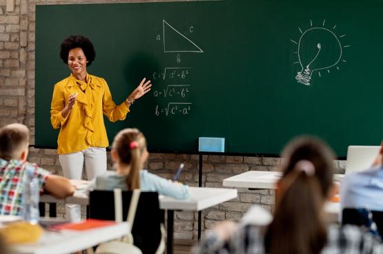 Teacher in front of classroom of children