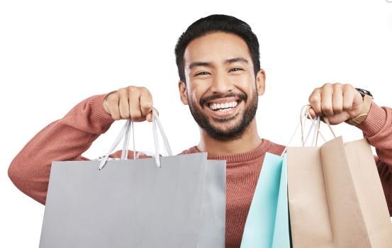 Happy man holding gift bags