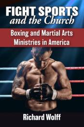 Man in boxing ring with boxing gloves.