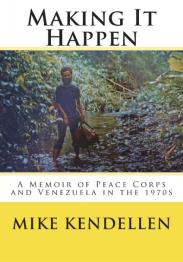 Man standing in wooded area next to creek.