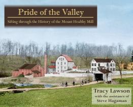Farm with several buildings and covered bridge.