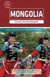 Two women dressed in Mongolian garb dancing.