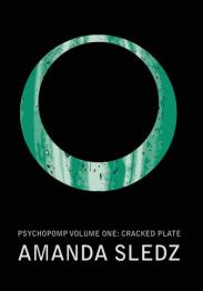 Black cover with green circle.