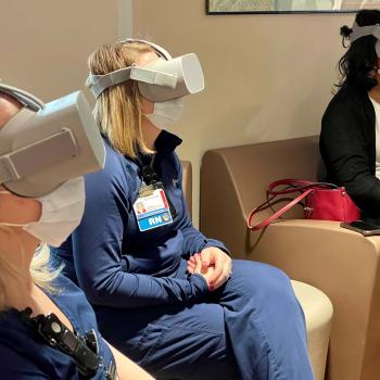 Health care workers wear virtual reality headsets during a study