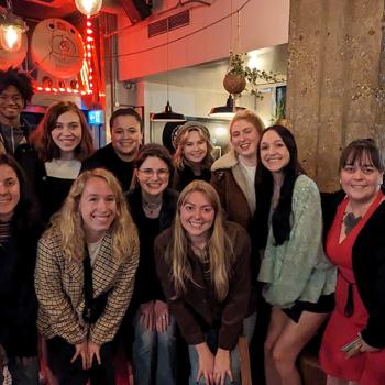 Students pose for a photo in a venue in London.