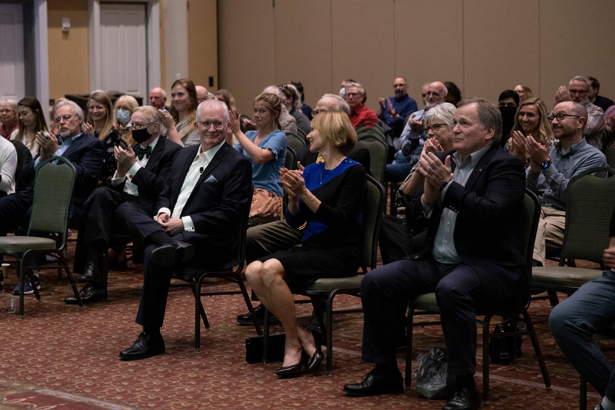 Family and friends congratulated Dr. Evans after he finished his Distinguished Professor Lecture.