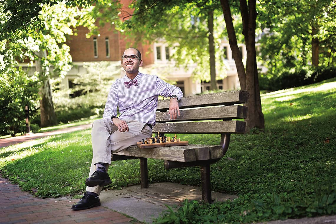 Amir Farnoud sits on a bench