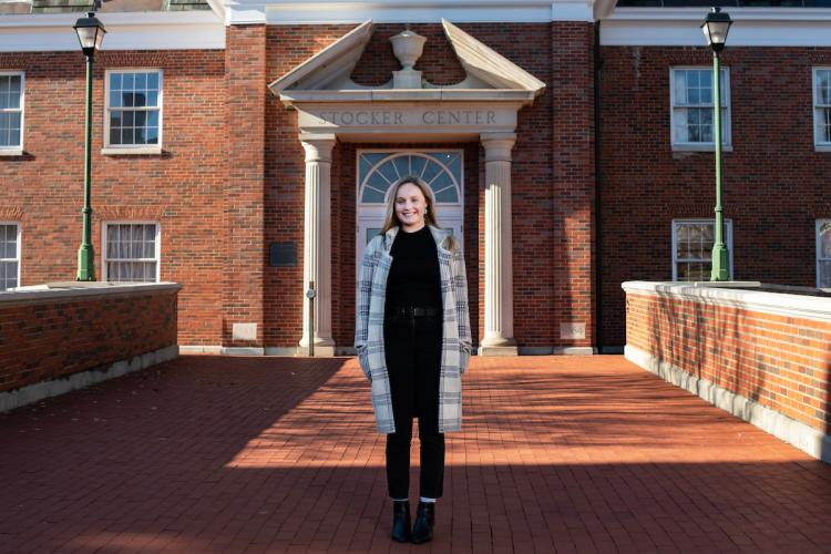 Cassidy Serger in front of Stocker Center