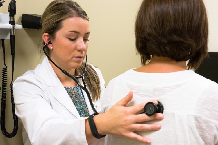 A doctor examines a patient