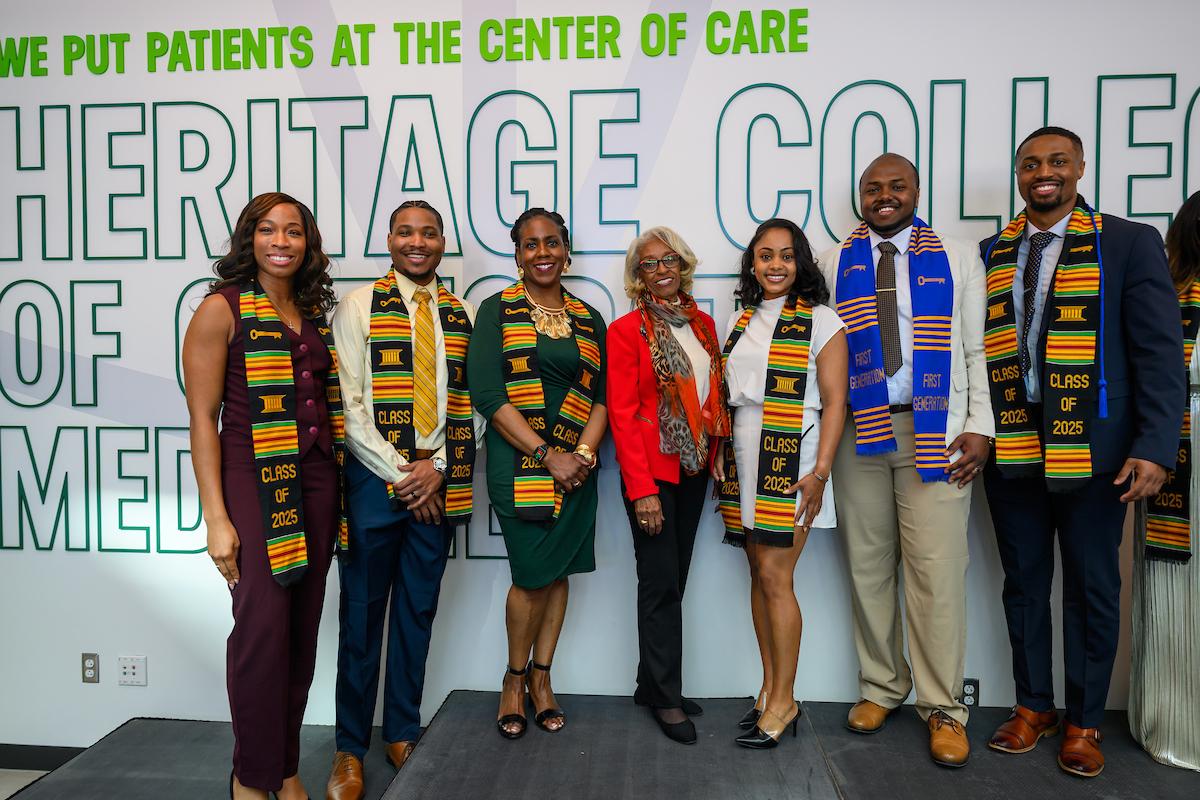 Former HCOM Dean Barbara Ross-Lee poses with students from the Class of 2025