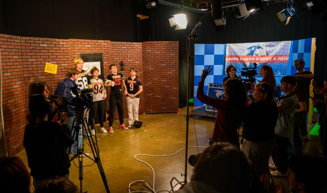Students on set before recording a take