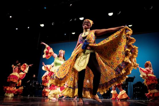 Dancers in colorful costumes perform at the 2024 World Music and Dance Concert