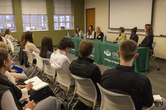 OHIO students listen to a panel of speakers at the Applied Finance Center
