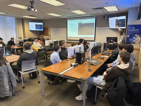 OHIO students listen to a speaker in the Applied Finance Center