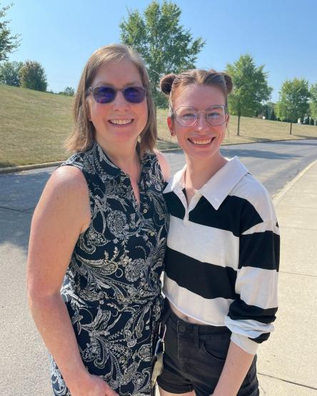 Dean Roberta Milliken poses for a photo with another individual