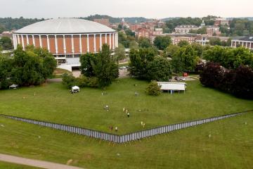 The Wall is a traveling three-quarter-sized replica of the Vietnam Veterans Memorial in Washington, D.C., set up in Tailgreat Park with the Convo Center overlooking.