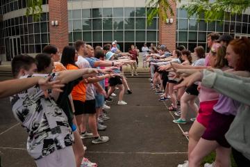 Student orientation leaders and staff get to know each other and participate in team-building activities outside Ping Fitness Center before Bobcat Student Orientation.