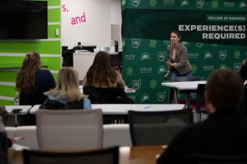 Claire Coder is shown speaking during Women Entrepreneurship Week