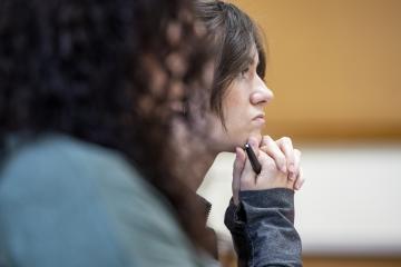 A photo of a person listening during a class