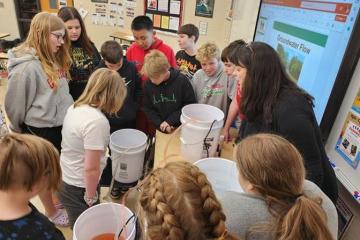 Deb McAvoy teaches students at Alexander Local Schools