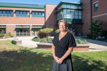 Innovation Center Director Stacy Strauss stands in front of the Center of Innovation