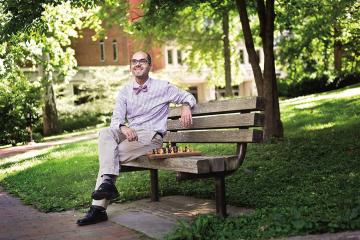 Amir Farnoud sits on a bench