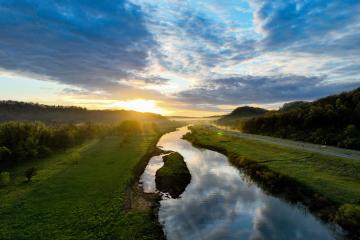 The Hocking River and the hills of southeastern Ohio are shown at sunrise