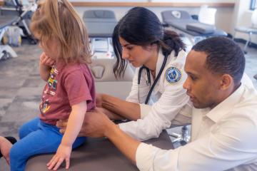 Ohio University students at the Heritage College of Osteopathic Medicine work in an OMM clinic in Dublin, Ohio.