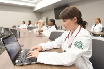 OHIO Nurse Practitioner program student working form their laptop.