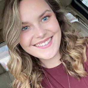 Ashlee Blankenship smiles in an angled selfie photo
