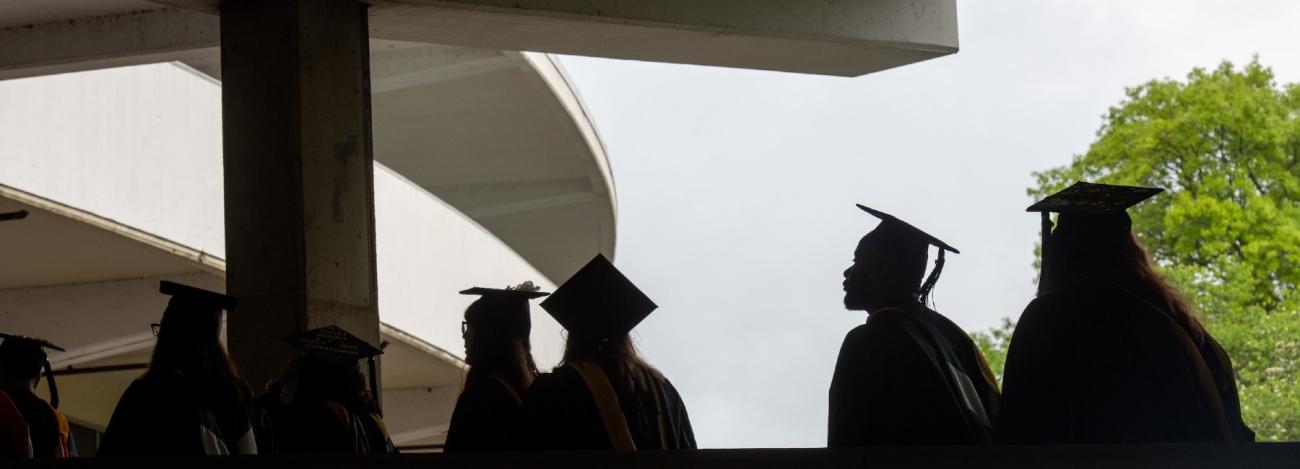 Students in caps and gowns at Commencement