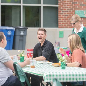 division staff talking at event
